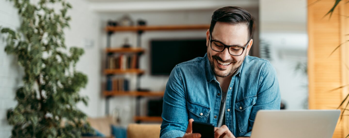 male patient looking at medical information on his phone with text reading NEW HMA REPORT with 3 takeaways about today’s patient financial experience from Waystar and The Health Management Academy